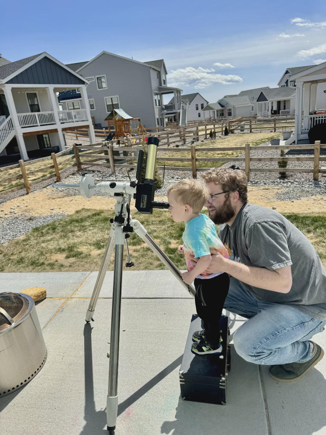 Wesley and I looking at the eclipse through a solar telescope